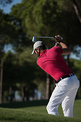 Image showing golfer hitting a sand bunker shot