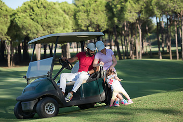 Image showing couple in buggy on golf course