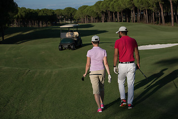 Image showing couple walking on golf course