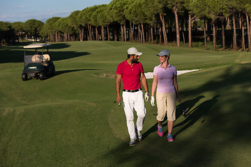 Image showing couple walking on golf course