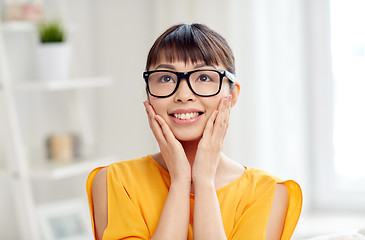 Image showing happy asian young woman in glasses at home