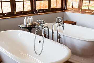 Image showing close up of bathroom with two bathtubs