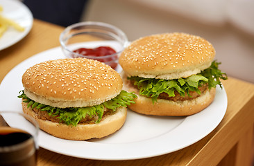 Image showing close up of two hamburgers on table