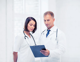 Image showing two doctors writing prescription