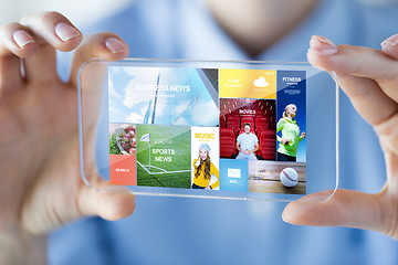 Image showing close up of woman with transparent smartphone