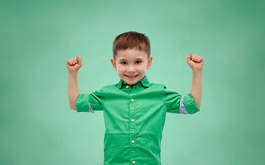 Image showing happy smiling little boy with raised hand