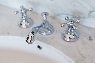 Image showing close up of bath tap or faucet at bathroom