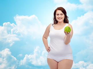 Image showing happy plus size woman in underwear with apple