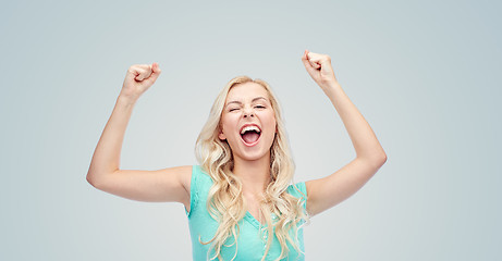 Image showing happy young woman or teen girl celebrating victory