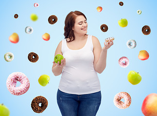 Image showing happy plus size woman choosing apple or donut