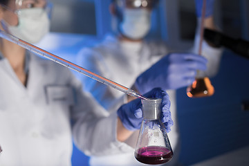 Image showing close up of scientists making test in lab