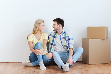 Image showing couple with cardboard boxes moving to new home