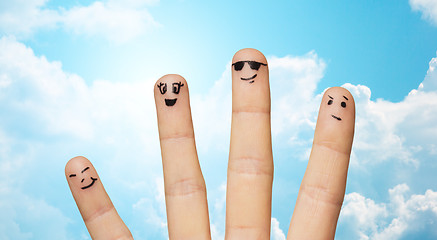 Image showing close up of four fingers family with smiley faces