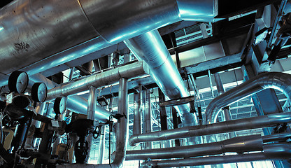 Image showing Equipment, cables and piping as found inside of a modern industr