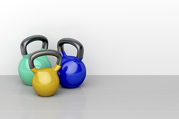 Image showing Three kettlebells