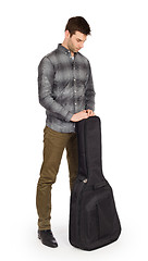 Image showing Musican with acoustic guitar in bag