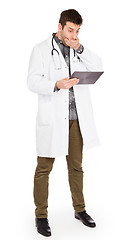 Image showing Male Caucasian doctor holding a digital tablet, looking shocked