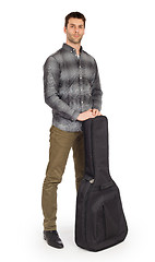 Image showing Musican with acoustic guitar in bag