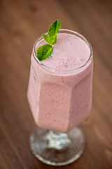 Image showing Strawberry smoothie on  table