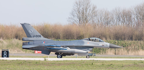 Image showing LEEUWARDEN, NETHERLANDS - APRIL 11, 2016: A dutch F-16 on the gr