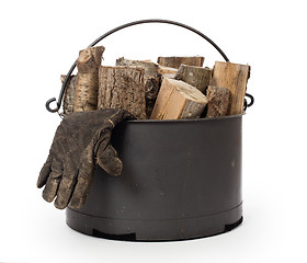 Image showing Metal basket of firewood