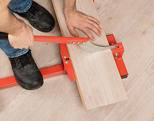 Image showing Red tool for cutting laminate