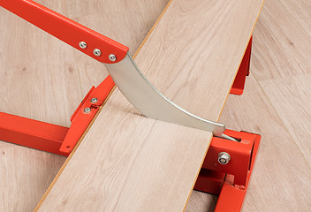 Image showing Red tool for cutting laminate