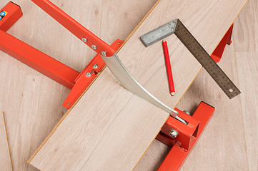 Image showing Red tool for cutting laminate