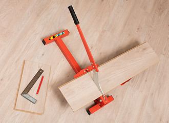 Image showing Red tool for cutting laminate