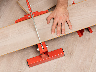 Image showing Red tool for cutting laminate