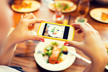 Image showing hands photographing food by smartphone 