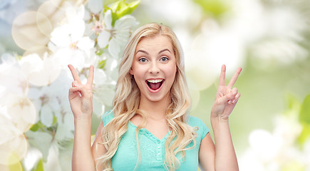 Image showing smiling young woman or teenage girl showing peace