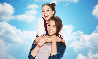 Image showing happy smiling pretty teenage girls hugging