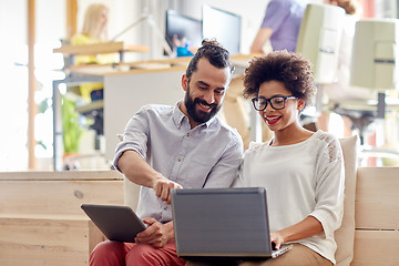 Image showing creative team with laptop and tablet pc in office