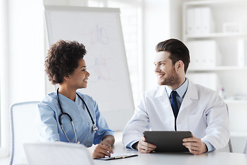 Image showing two happy doctors meeting at hospital office