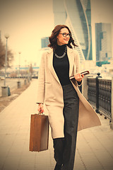 Image showing middle-aged woman in a bright coat