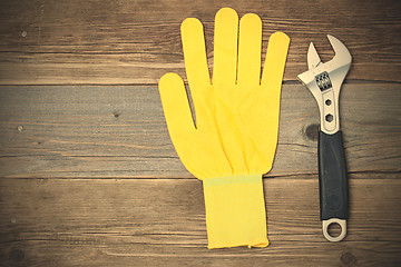 Image showing yellow glove and adjustable spanner