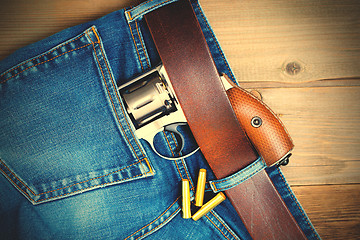 Image showing silver revolver nagant in the pocket