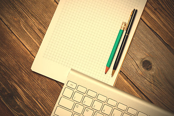 Image showing Computer keyboard, notebook and pen