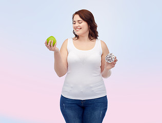 Image showing happy plus size woman choosing apple or donut