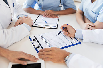 Image showing close up of doctors with clipboards at hospital