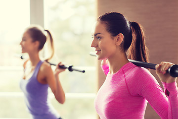 Image showing group of people exercising with bars in gym