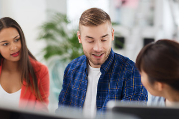 Image showing happy creative team or students working at office