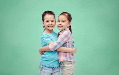 Image showing happy smiling little girls hugging