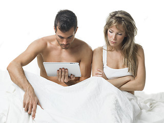 Image showing uncommunicative couple on bed in white 