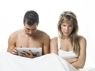 Image showing uncommunicative couple on bed in white 