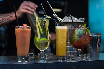 Image showing cocktails on bar background