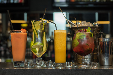 Image showing cocktails on bar background