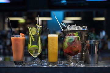 Image showing cocktails on bar background