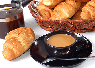 Image showing cup of coffee with fresh croissants